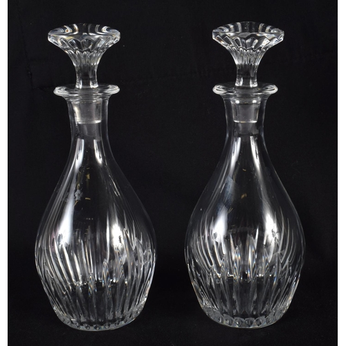 66 - A PAIR OF FRENCH BACCARAT GLASS DECANTERS. 16 cm high.