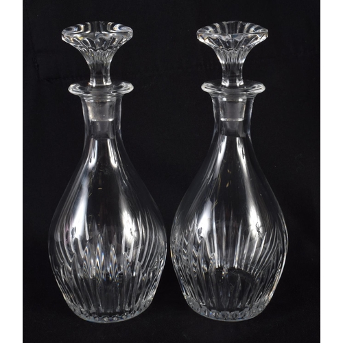 66 - A PAIR OF FRENCH BACCARAT GLASS DECANTERS. 16 cm high.