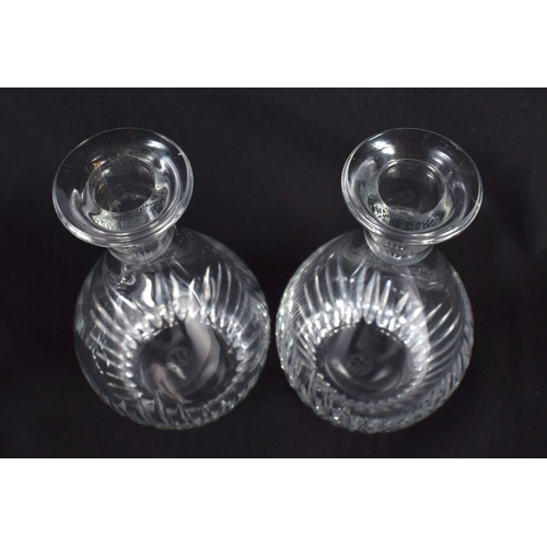 66 - A PAIR OF FRENCH BACCARAT GLASS DECANTERS. 16 cm high.