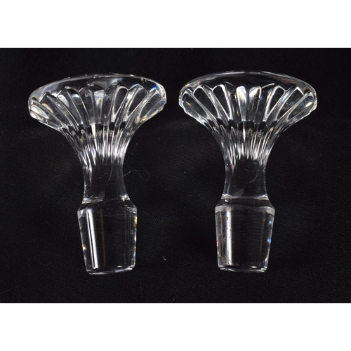 66 - A PAIR OF FRENCH BACCARAT GLASS DECANTERS. 16 cm high.