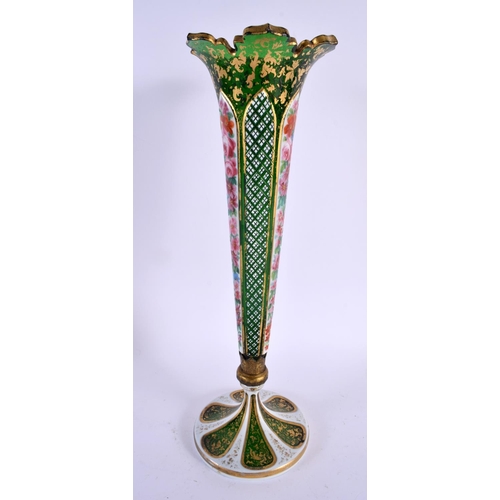 667 - A LARGE ANTIQUE BOHEMIAN ENAMELLED GLASS VASE painted with flowers. 36 cm high.