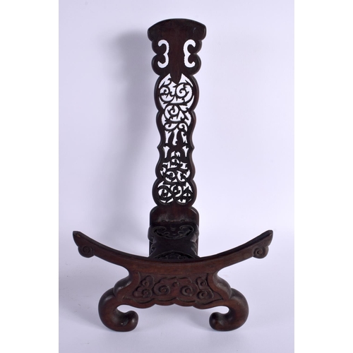 668 - A LARGE PAIR OF 19TH CENTURY CHINESE CARVED HARDWOOD DISPLAY STANDS Qing. 35 cm x 18 cm.