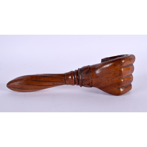 675 - AN ANTIQUE TREEN NUT CRACKER. 20 cm long.