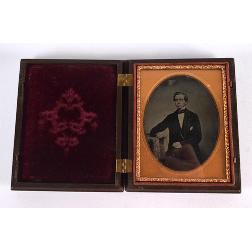 677 - AN ANTIQUE DAGUERREOTYPE together with an art deco figure & a shell. Largest 16 cm high. (3)