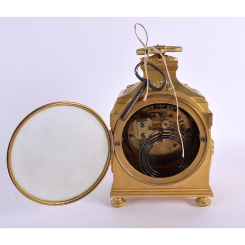 679 - AN EARLY 19TH CENTURY FRENCH ORMOLU PARIS CLOCK overlaid with foliage and vines. 23 cm x 12 cm.