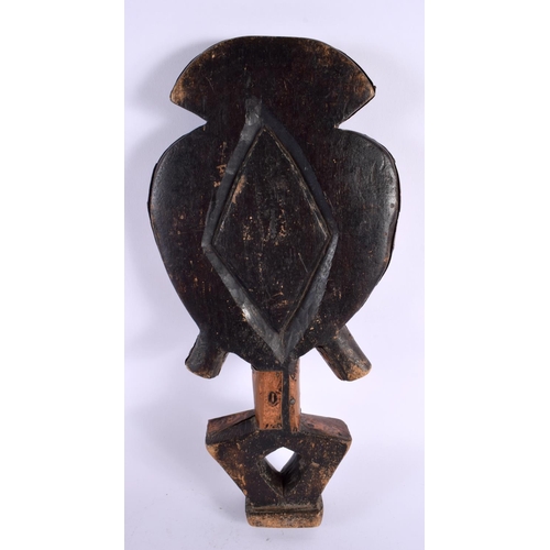 682 - A VINTAGE TRIBAL CARVED WOOD COPPER MOUNTED FIGURE. 42 cm x 18 cm.