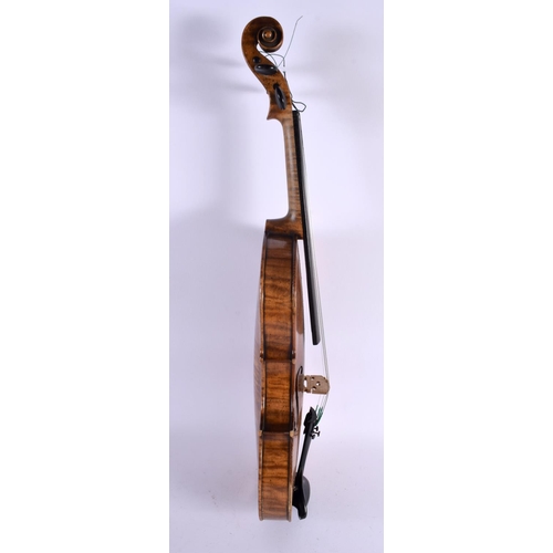 684 - AN ANTIQUE SINGLE PIECE BACK VIOLIN with bow. Violin 58 cm long, length of back 36 cm. (2)