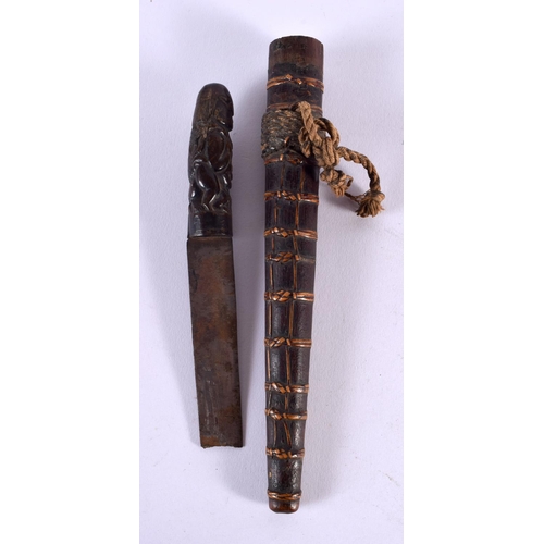 685 - A 19TH CENTURY CONTINENTAL CARVED RHINOCEROS HORN HANDLED TRIBAL KNIFE with bamboo scabbard. 28 cm l... 