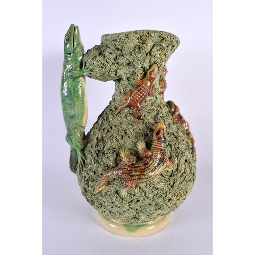 69 - A LARGE ANTIQUE PORTUGUESE MAJOLICA PALISSY TYPE JUG overlaid with frogs and lizards. 30 cm x 18 cm.