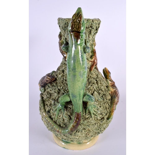 69 - A LARGE ANTIQUE PORTUGUESE MAJOLICA PALISSY TYPE JUG overlaid with frogs and lizards. 30 cm x 18 cm.