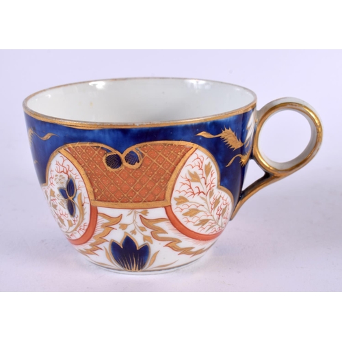 694 - A LARGE EARLY 19TH CENTURY STAFFORDSHIRE FIGURE OF A LION together with an English cup and saucer. L... 