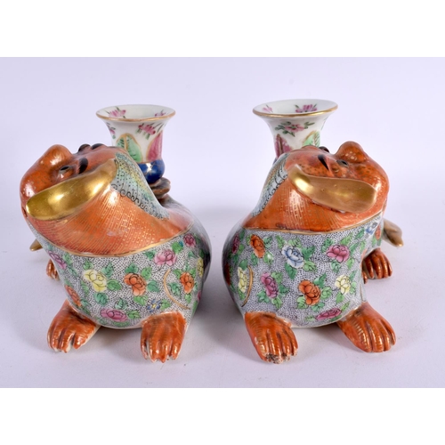 706 - A PAIR OF 19TH CENTURY CHINESE FAMILLE ROSE PORCELAIN JOSS STICK HOLDERS formed with Buddhistic lion... 