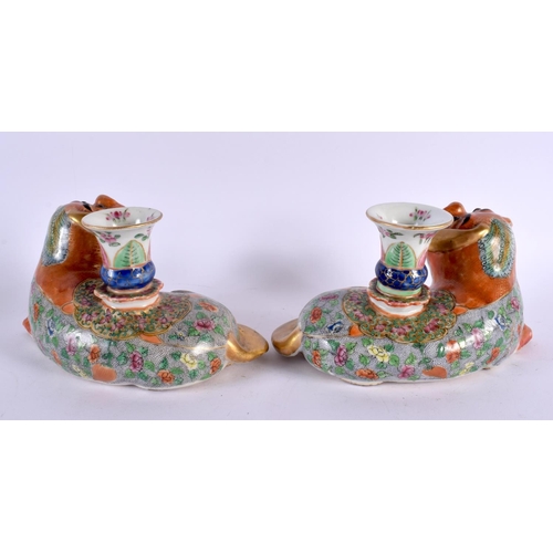 706 - A PAIR OF 19TH CENTURY CHINESE FAMILLE ROSE PORCELAIN JOSS STICK HOLDERS formed with Buddhistic lion... 