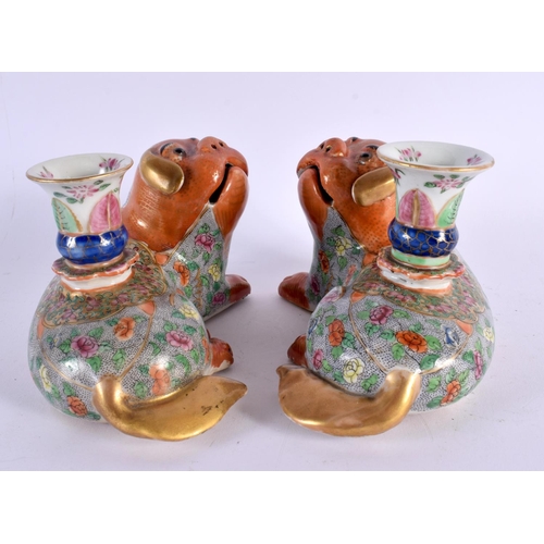 706 - A PAIR OF 19TH CENTURY CHINESE FAMILLE ROSE PORCELAIN JOSS STICK HOLDERS formed with Buddhistic lion... 