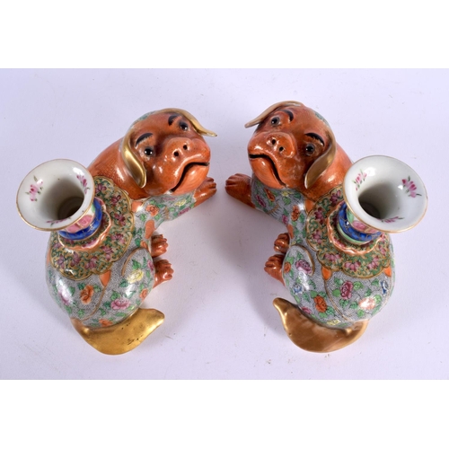 706 - A PAIR OF 19TH CENTURY CHINESE FAMILLE ROSE PORCELAIN JOSS STICK HOLDERS formed with Buddhistic lion... 