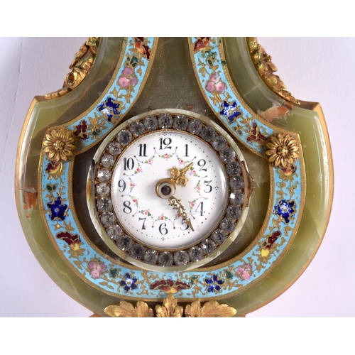 709 - A FINE LATE 19TH CENTURY FRENCH ONYX ORMOLU AND CHAMPLEVE ENAMEL MANTEL CLOCK decorated with foliage... 