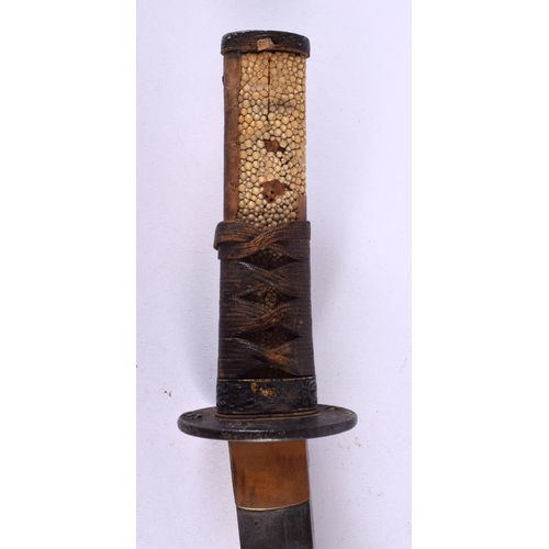 721 - A 19TH CENTURY JAPANESE MEIJI PERIOD SHAGREEN HANDLED WAKAZASHI SWORD with iron mounts. 57 cm long.