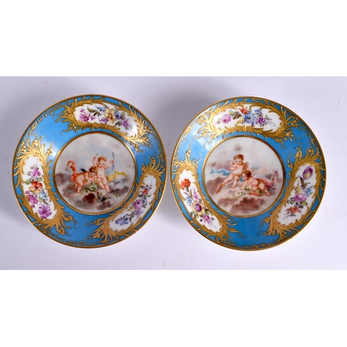 722 - A PAIR OF LATE 19TH CENTURY FRENCH SEVRES PORCELAIN CUPS AND SAUCERS painted with putti. 10.5 cm dia... 