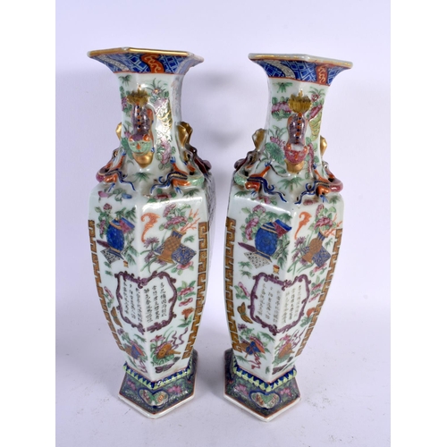 724 - A LARGE PAIR OF 19TH CENTURY CHINESE CANTON FAMILLE ROSE VASES Qing. 30 cm x 14 cm.