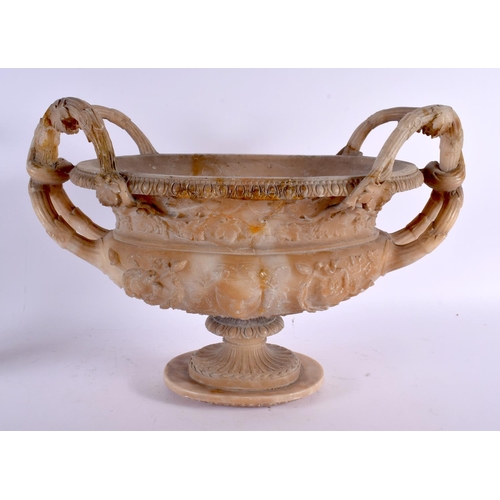 735 - A LARGE 19TH CENTURY ITALIAN GRAND TOUR CARVED ALABASTER URN decorated with mask heads and flowers. ... 