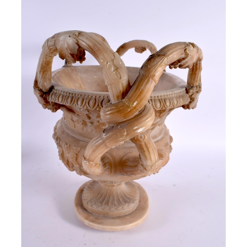 735 - A LARGE 19TH CENTURY ITALIAN GRAND TOUR CARVED ALABASTER URN decorated with mask heads and flowers. ... 