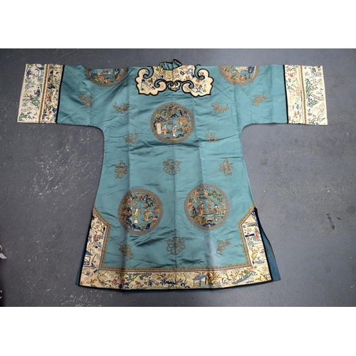 741 - A FINE 19TH CENTURY CHINESE GREEN SILK EMBROIDERED JACKET Qing, decorated with eight roundels and fi... 