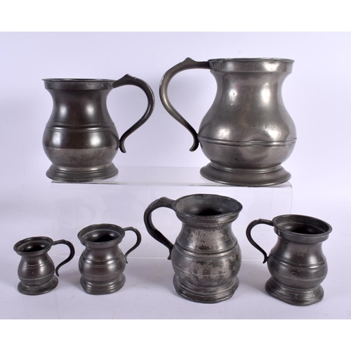 768 - SIX ANTIQUE CONTINENTAL PEWTER MEASURING JUGS. Largest 18 cm x 12 cm. (6)