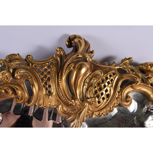 769 - A LARGE ANTIQUE GILT BRONZE HANGING WALL CANDLE STICK MIRROR. 48 cm x 32 cm.