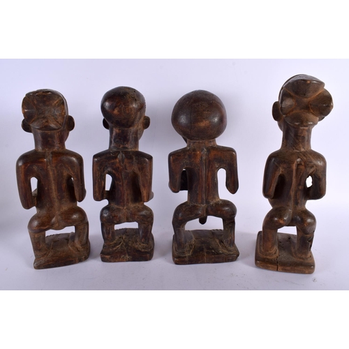 777 - FOUR AFRICAN TRIBAL CARVED WOOD FIGURES. 29 cm high. (4)