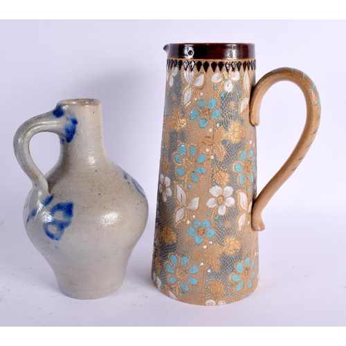 781 - AN ANTIQUE DOULTON LAMBETH JUG together with a stoneware jug. Largest 21 cm high. (2)