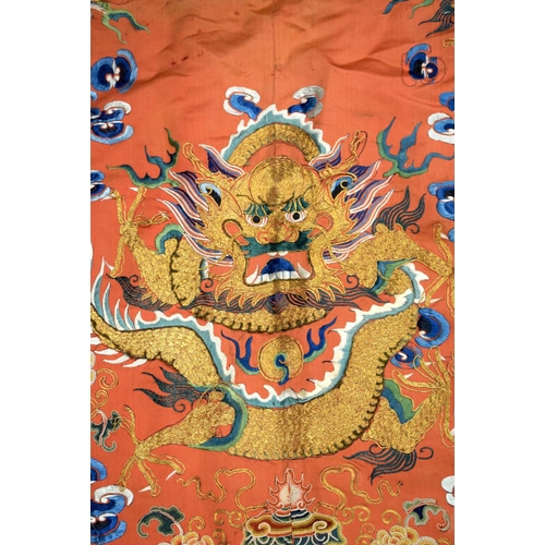 783 - A LARGE 19TH CENTURY CHINESE ORANGE SILK WORK EMBROIDERED DRAGON ROBE together with a rank badge and... 