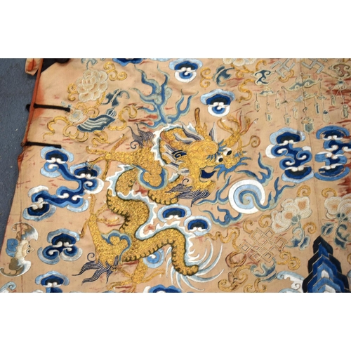 783 - A LARGE 19TH CENTURY CHINESE ORANGE SILK WORK EMBROIDERED DRAGON ROBE together with a rank badge and... 