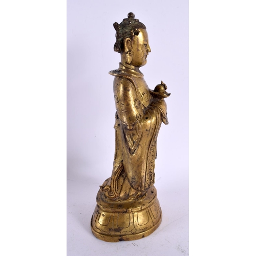 784 - A 17TH CENTURY CHINESE GILT BRONZE FIGURE OF AN IMMORTAL Ming/Qing. 24 cm high.