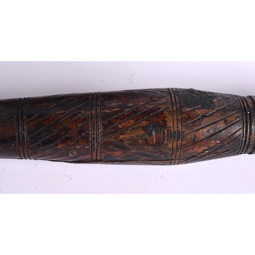 798 - A LARGE ANTIQUE NORTH AFRICAN BEDOUIN CARVED WOOD PESTLE AND MORTAR overlaid with stud work. 68 cm h... 