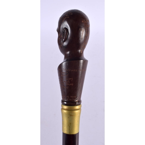 807 - A PHRENOLOGY HEAD WALKING CANE. 90 cm long.