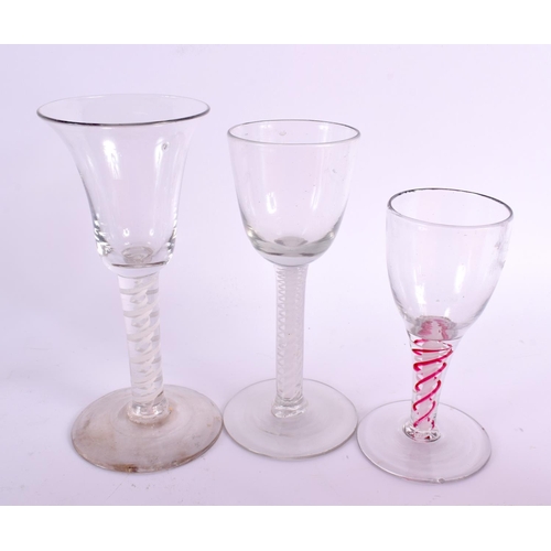 819 - EIGHT ANTIQUE SPIRAL TWIST WINE GLASSES. Largest 20 cm high. (8)