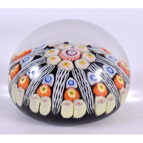 82 - A GLASS PAPERWEIGHT. 6.5 cm wide.