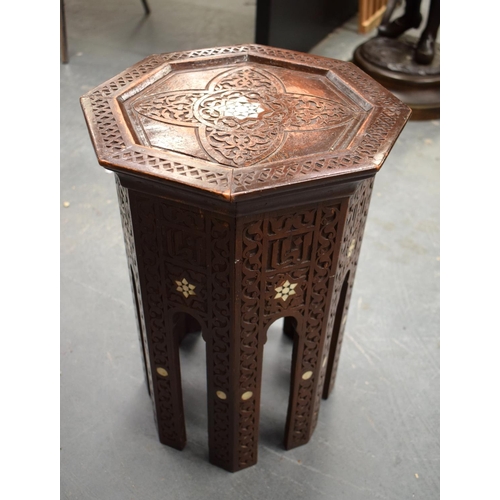 832 - AN ANTIQUE MIDDLE EASTERN MOORISH LIBERTY TYPE TABLE depicting a central mother of pearl star. 40 cm... 