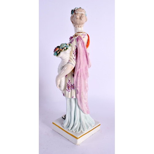 84 - A LARGE 18TH CENTURY ENGLISH PORCELAIN FIGURE OF A FEMALE modelled holding flowers. 26 cm high.