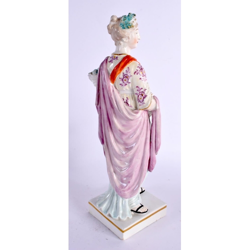 84 - A LARGE 18TH CENTURY ENGLISH PORCELAIN FIGURE OF A FEMALE modelled holding flowers. 26 cm high.