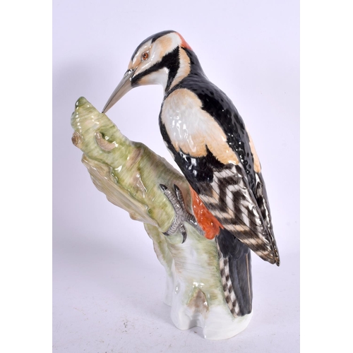 102 - A LARGE KPM BERLIN PORCELAIN FIGURE OF A BIRD. 25 cm high.