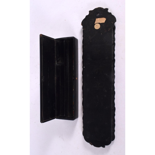 110 - AN ANTIQUE COUNTRY HOUSE BLACK LACQUER PEN BOX and similar letter rack. Largest 32 cm x 6 cm. (2)