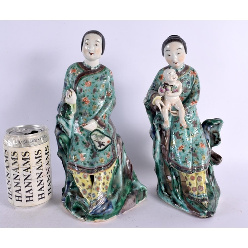 113 - A PAIR OF 19TH CENTURY CHINESE FAMILLE VERTE PORCELAIN FIGURES Kangxi style, one figure holding a ba... 