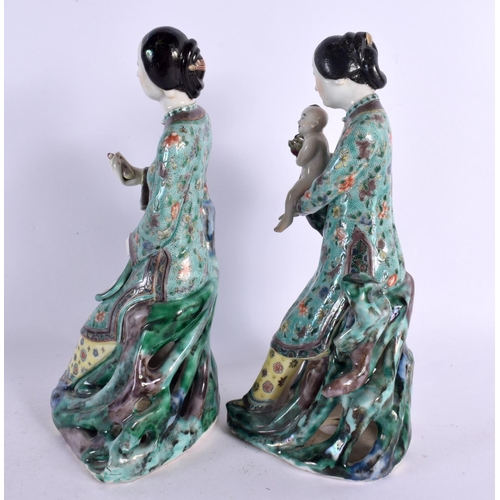 113 - A PAIR OF 19TH CENTURY CHINESE FAMILLE VERTE PORCELAIN FIGURES Kangxi style, one figure holding a ba... 