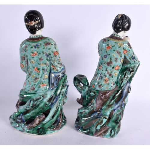 113 - A PAIR OF 19TH CENTURY CHINESE FAMILLE VERTE PORCELAIN FIGURES Kangxi style, one figure holding a ba... 