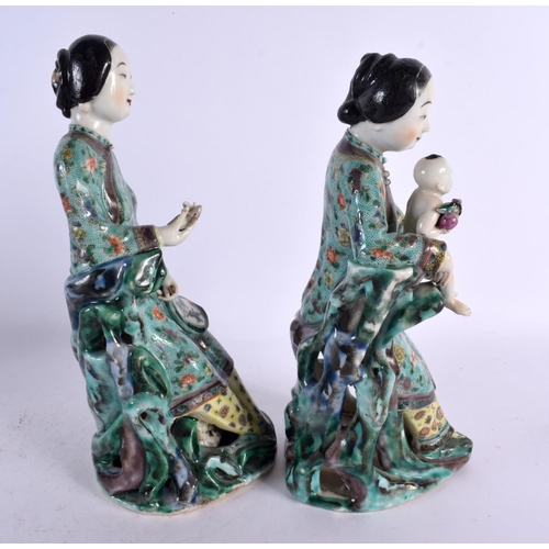 113 - A PAIR OF 19TH CENTURY CHINESE FAMILLE VERTE PORCELAIN FIGURES Kangxi style, one figure holding a ba... 