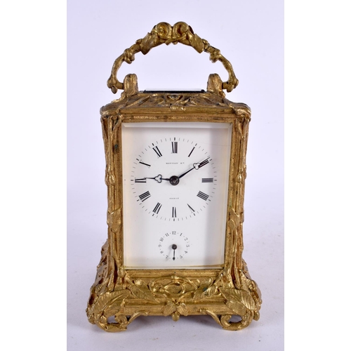 133 - A 19TH CENTURY FRENCH ART NOUVEAU BRASS CARRIAGE CLOCK overlaid with vines and foliage. 18 cm high i... 