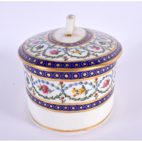 145 - Sevres butter box and cover elaborately painted with flowers surrounded by chains of blue pearls and... 