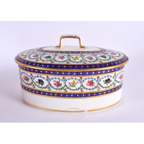 145 - Sevres butter box and cover elaborately painted with flowers surrounded by chains of blue pearls and... 