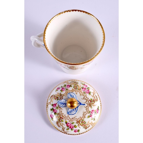 147 - Sevres chocolate cup and cover painted with roses surrounded by gilding, interlaced Ls gg and five ... 